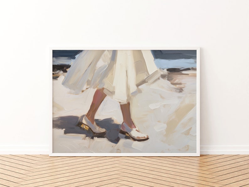 May include: An abstract painting of a person walking, wearing white shoes with gold heels. The person is wearing a white dress or skirt. The artwork is framed in a white border and set against a white wall and wooden floor.