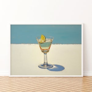May include: A painting of a martini glass with a lime wedge on a white surface against a blue background.