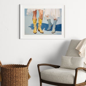May include: A painting of two pairs of legs wearing cowboy boots. One pair of boots is yellow and the other pair is blue. The boots are on a light blue background.