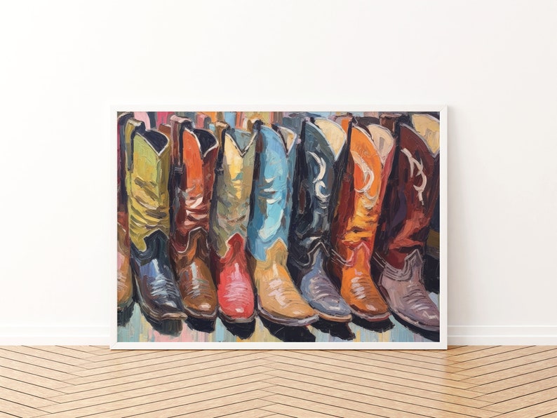 May include: A framed painting depicting a row of colorful cowboy boots in various shades including yellow, orange, red, blue, black, and brown. The artwork features visible brushstrokes and a textured application of paint, showcasing the boots side by side.