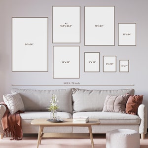 May include: A living room interior design mockup with a beige sofa and a coffee table. The wall is decorated with a gallery wall of framed prints in various sizes. The prints are labeled with their dimensions in inches. The sofa is 72 inches wide.