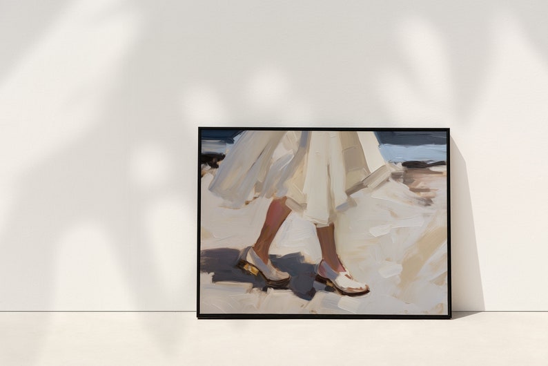 May include: Framed art print featuring an impressionistic painting of a person walking. The artwork depicts legs and feet in white shoes, with a flowing white dress. The painting has a soft color palette of white, beige, and blue.