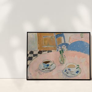 May include: A framed painting depicting a pink table with two teacups, saucers, and a small vase of flowers. The background shows a blue chair, a yellow cabinet, and a black and white checkered floor, all rendered in a loose, painterly style.