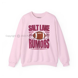RHOSLC Rumors Football Unisex Crewneck Sweatshirt | Real Housewives Of Salt Lake City Rumors & Nastiness Fan Shirt | Bravo Quote Merch Gift
