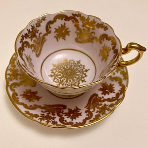Paragon fine bone china cup and saucer. Vintage. The Queen & HM Queen Mary backstamp used  1939 to 1949. Pink with gold snowflake. S  second