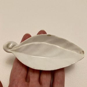 Royal Worcester Victorian tiny white leaf pickle dish. 1884 backstamp. Damaged but a scarce English porcelain item. 4 inches (10 cm) long.