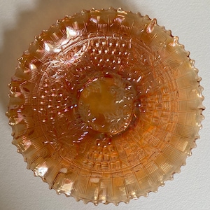 Northwood vintage carnival glass bowl. Pie crust edge leaves grapes and vines. Marigold colour. 8 1/2 inch diameter, 2 inches high.