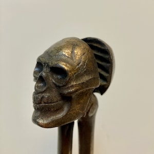 Skull (nut cracker) and bones (handles). Vintage heavy metal nut cracker. British design registered in 1928 (Rd# 740410). Maker’s mark: HJB