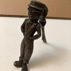 Nut cracker . American comedy actor Harold Lloyd. Heavy cast iron vintage novelty nutcracker made by Nestor, England. Design registered 1929