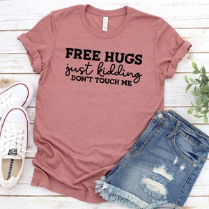 Free hugs...just kidding, dont touch me Unisex Jersey Short Sleeve Tee