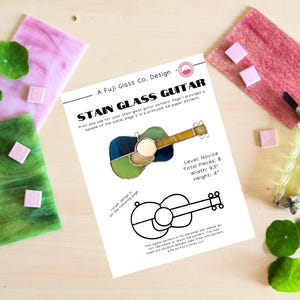 May include: A printable stained glass pattern for a guitar. The pattern is for a novice level project and includes 8 pieces. The guitar is 9.5 inches wide and 4 inches tall.