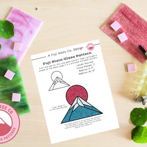 May include: A printable stained glass pattern for a beginner level project. The pattern is for a stylized mountain design with a red sun and blue mountain. The pattern is approximately 7 inches tall and 6 inches wide.