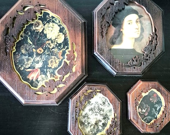 May include: Four octagonal picture frames with dark brown wood grain finish and intricate cut-out leaf patterns along the inner edges. The frames contain various images including a floral bouquet, a portrait of a person, and patterned prints.