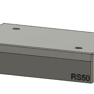 May include: A rectangular gray metal mounting bracket with a flat top surface featuring four circular holes. The side of the component is clearly marked with the text RS50. The bracket includes two side flanges, each containing two circular mounting holes.