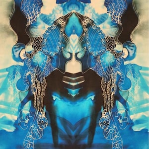 May include: Abstract artwork featuring a symmetrical design in shades of blue and black. The image has a watercolor effect with intricate white line details, creating a visually complex and artistic composition. The overall theme is artistic and decorative.