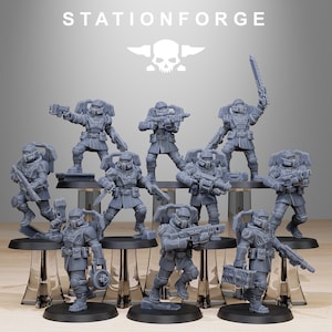 May include: A set of ten gray plastic miniature figures of soldiers wearing futuristic armor and holding weapons. The figures are standing on round bases. The figures are part of a tabletop wargame.