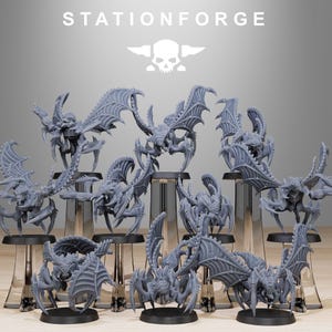 May include: A set of 10 grey, detailed, plastic miniature figures of creatures with wings and multiple legs. The figures are arranged on a grey surface.