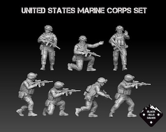 May include: A set of seven grey plastic figurines depicting United States Marines in various combat poses. The Marines are holding rifles and wearing tactical gear. The figurines are part of a set called "United States Marine Corps Set" by Black Hills Games.