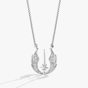 May include: A silver necklace with a pendant featuring a stylized Rebel Alliance symbol with a diamond-encrusted design.