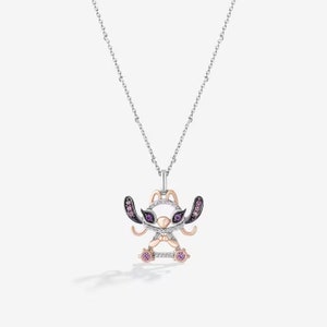 May include: A silver chain necklace with a pendant featuring a cartoon Stitch character. The pendant is made of silver and rose gold and is decorated with purple and pink gemstones.