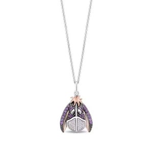 May include: Silver necklace with a pendant featuring a purple and white Eeyore design. The pendant has a silver chain and a rose gold accent on the ears and hair. The Eeyore pendant is adorned with purple and white stones.