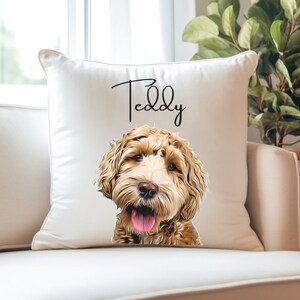 May include: White cushion with a brown and white dog's face and the name "Teddy" written in cursive.