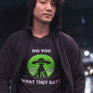 Alien Inspired Unisex Tee, Conspiracy Theory Believe in Aliens Gift for Him or Her, UFO T-Shirt, Extraterrestrial Shirt, Sci-Fi Top, Space