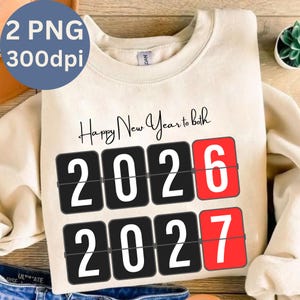 May include: Cream-colored sweatshirt with the text "Happy New Year to both." The design features a flip clock style display showing the years 2026 and 2027. A blue circle in the upper left corner reads "2 PNG 300dpi."
