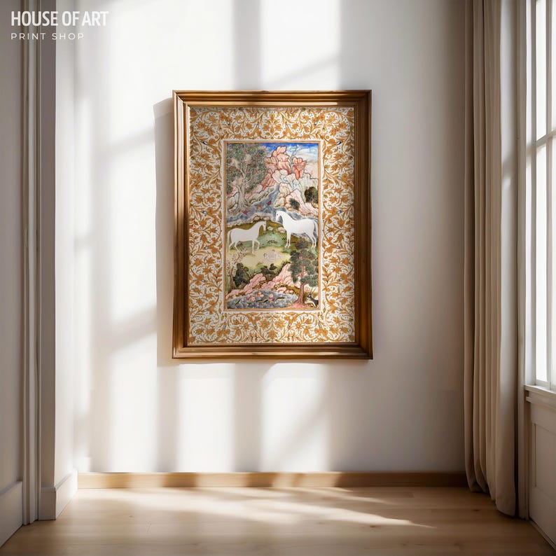 May include: A framed artwork featuring a detailed illustration of two white horses in a landscape with trees and pink and green foliage. The frame is gold with an ornate floral pattern. The text "HOUSE OF ART PRINT SHOP" is in the upper left corner.
