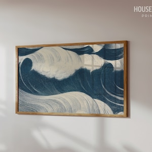 May include: A framed print of a blue and white abstract wave design. The waves are painted with brushstrokes and have a textured look.