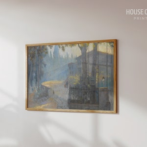 May include: A framed painting depicting a street scene with buildings, trees, and figures in a hazy, atmospheric style. The painting is in a light blue and gray color palette.