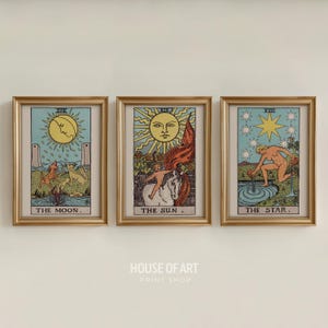 May include: Three framed tarot card prints. The cards are "The Moon", "The Sun", and "The Star". Each card features colorful illustrations with gold frames. The bottom of the image has the text "HOUSE OF ART PRINT SHOP".