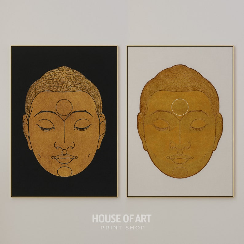 May include: Two framed prints of gold-toned illustrations of a person's face with eyes closed. The face is outlined in black and has a circle on the forehead. The background of one print is black and the other is white.