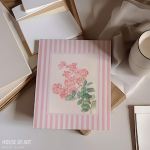 May include: A floral print art print featuring pink flowers and green leaves, set against a white background. The print is framed by a pink and white striped border. The words "HOUSE OF ART PRINT SHOP" are at the bottom.
