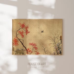 May include: A framed print with a Japanese landscape design on a gold background. It shows a tree with red leaves and a bird in flight. Tall grasses and flowers are also included. The text "HOUSE OF ART PRINT SHOP" is at the bottom of the print.