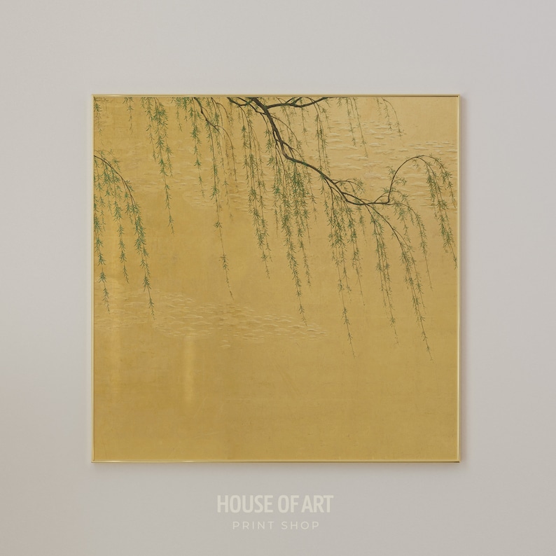 May include: A painting of a willow tree branch with green leaves hanging over a gold background. The painting is framed in a thin gold frame.
