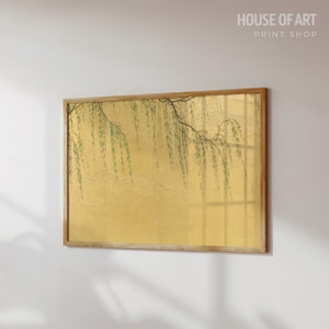 May include: A framed print of a willow tree branch with green leaves hanging over a golden background. The print is in a wooden frame.