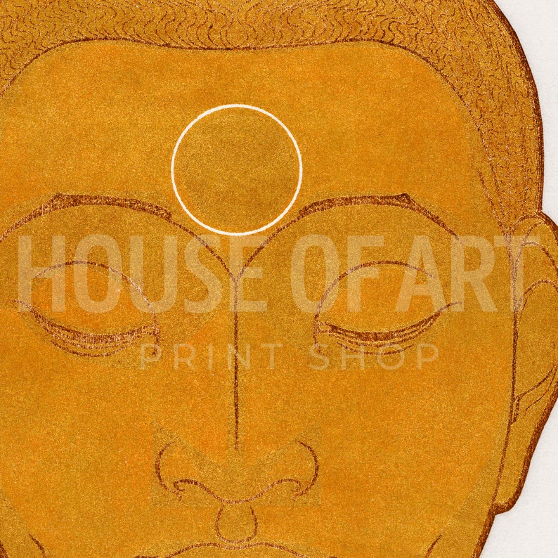 May include: A close-up of a golden Buddha statue with a white circle on the forehead. The statue has closed eyes and a serene expression.