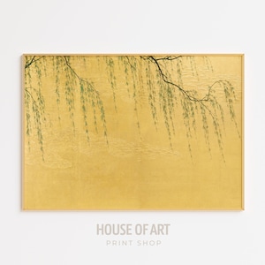 May include: A framed print of a willow tree branch with green leaves hanging over a gold background.