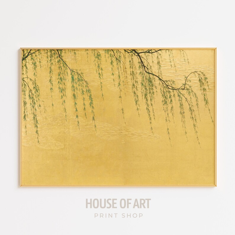 May include: A framed print of a willow tree branch with green leaves hanging over a gold background.