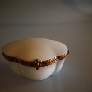 Finely curved oval white Limoges jar made of porcelain