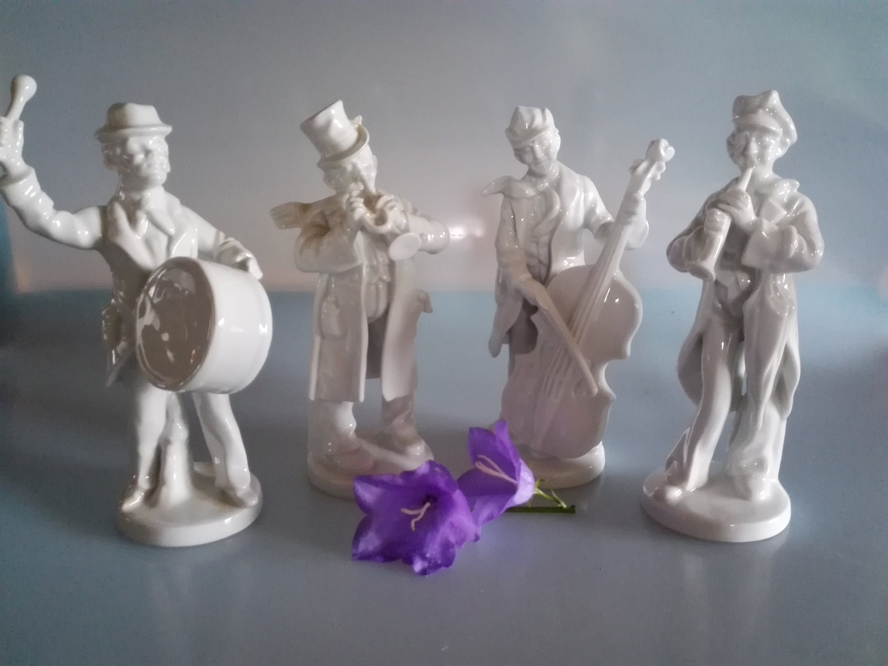 Set of four street musicians made of white porcelain