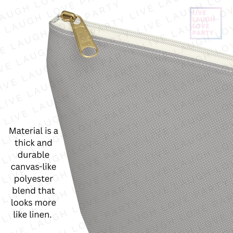 May include: Close-up of a gray canvas-like polyester blend pouch with a gold zipper. The material is thick and durable, resembling linen. The text on the pouch reads "Live Laugh Love Party".