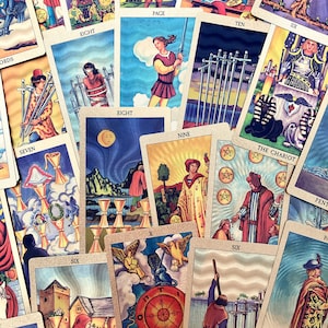 May include: A spread of tarot cards with colorful illustrations and gold accents. The cards include the Eight of Swords, the Nine of Swords, the Ten of Swords, the Page of Swords, the Eight of Cups, the Six of Cups, the Chariot, the Wheel of Fortune, and the Six of Swords.