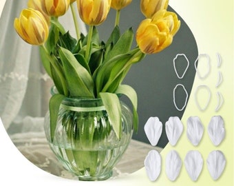 May include: A set of white silicone molds for making tulip flower decorations. The molds are shown next to a bouquet of yellow tulips in a clear glass vase.