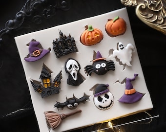 May include: White silicone mold with 12 Halloween themed shapes, including a ghost, pumpkin, witch hat, spider, and haunted house. The mold measures 10.7 inches.