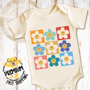 our happy face daisy toddler shirt and onesie is perfect for your loved one or as a gift.