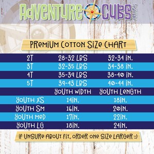 May include: A size chart for youth clothing with measurements in inches and pounds. The chart includes sizes 2T, 3T, 4T, and 5T, as well as youth sizes XS, SM, MED, and LG. The chart also includes a note that if unsure about fit, order one size larger.