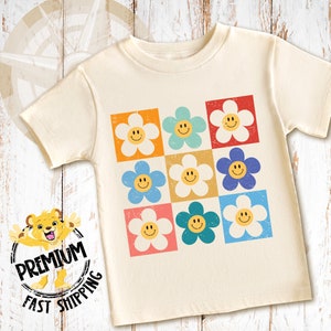 our happy face daisy toddler shirt and onesie is perfect for your loved one or as a gift.