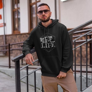 May include: A black hooded sweatshirt with a white graphic of a dice with the text "ROGUE LIFE" on it.